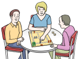 Eine Gruppe von Menschen spielt ein Brettspiel